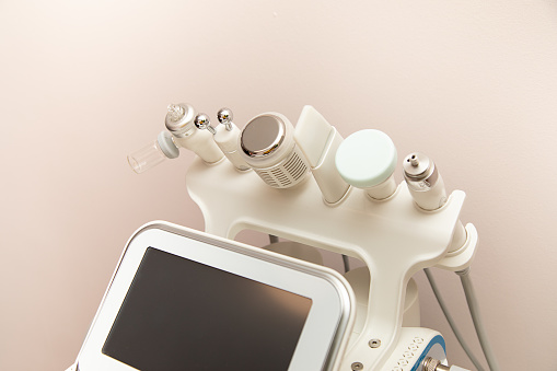 Attachments to device HydraFacial facial skin care machine in spa clinic for anti-aging or acne treatment. concept of aesthetic medicine, self-care, latest technologies in beauty industry, photo